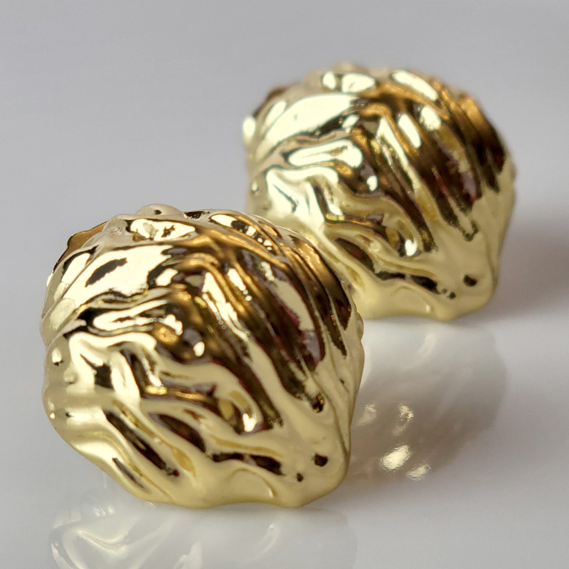 Crafted from premium, hypoallergenic stainless steel, our Golden Walnut Stud Earrings are built to last. The tarnish-proof material ensures they will maintain their shine for years to come. Plus, they're lightweight and sustainable, making them the perfect low maintenance accessory for any outfit.