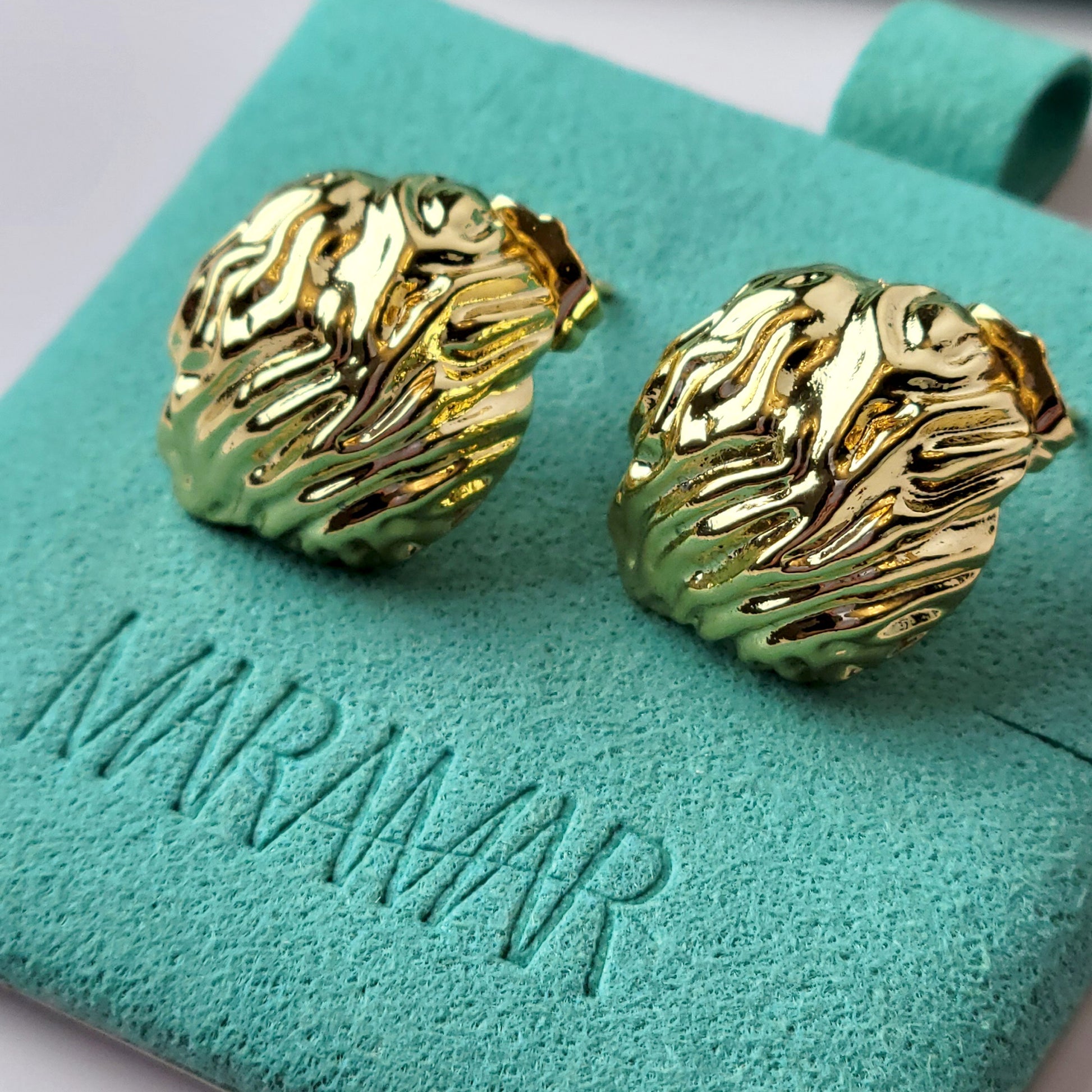 Crafted from premium, hypoallergenic stainless steel, our Golden Walnut Stud Earrings are built to last. The tarnish-proof material ensures they will maintain their shine for years to come. Plus, they're lightweight and sustainable, making them the perfect low maintenance accessory for any outfit.