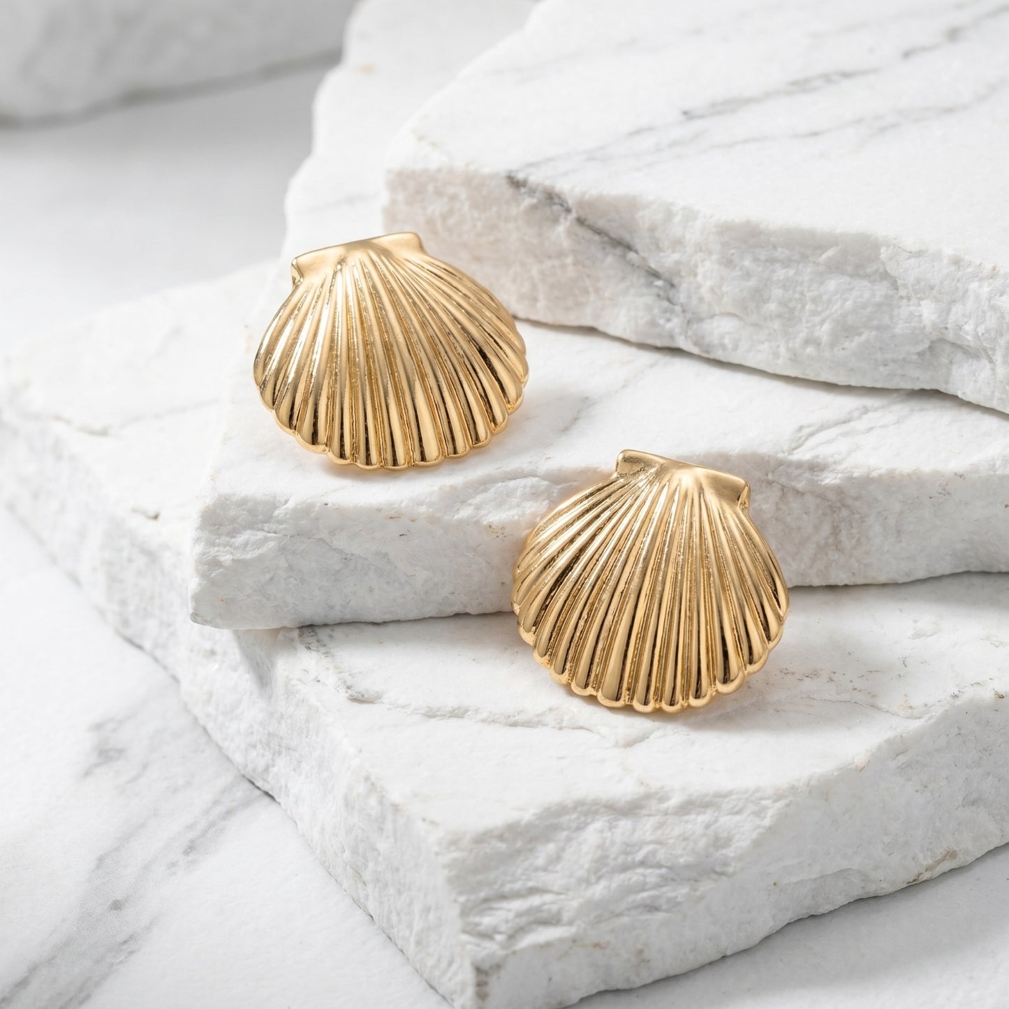 Large Golden Shell Stud Earrings with a gold seashell design in waterproof stainless steel.