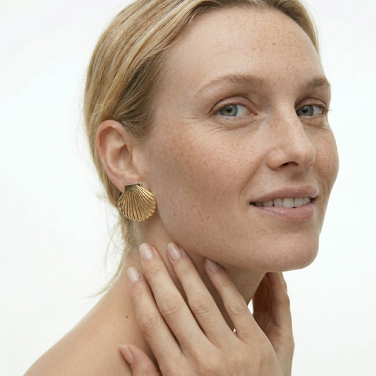 Large Golden Shell Stud Earrings with a gold seashell design in waterproof stainless steel.