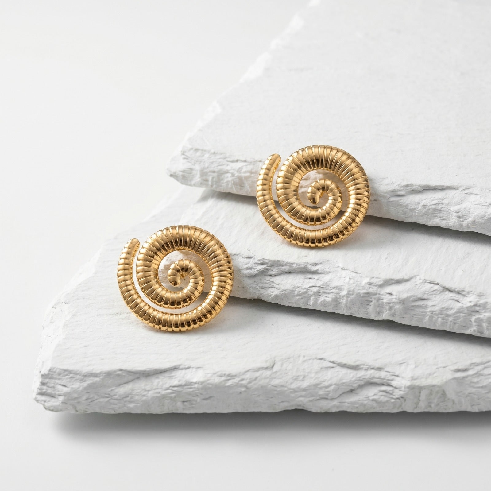 Large Golden Spiral Stud Earrings featuring an elegant spiral design in waterproof stainless steel.