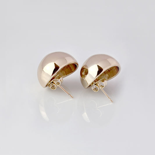 Crafted with precision and expertly designed, our Large Rose Gold Half Ball Stud Earrings are the perfect choice for those seeking high-quality and sustainable fashion. Made with hypoallergenic and tarnish-proof stainless steel, these earrings are low-maintenance and lightweight, making them a comfortable and stylish addition to any outfit.