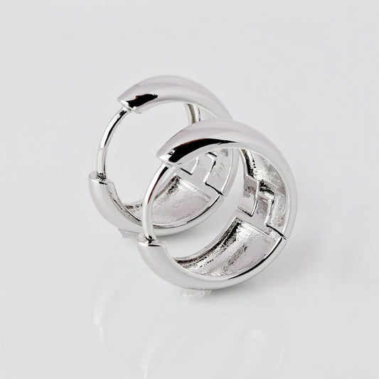Crafted from the highest quality hypoallergenic and sustainable stainless steel, these Large Silver Bold Hoop Earrings are both stylish and practical. Tarnish-proof and lightweight, they make for an effortless and low maintenance accessory, perfect for any occasion. Add a touch of elegance to your look with these versatile earrings.