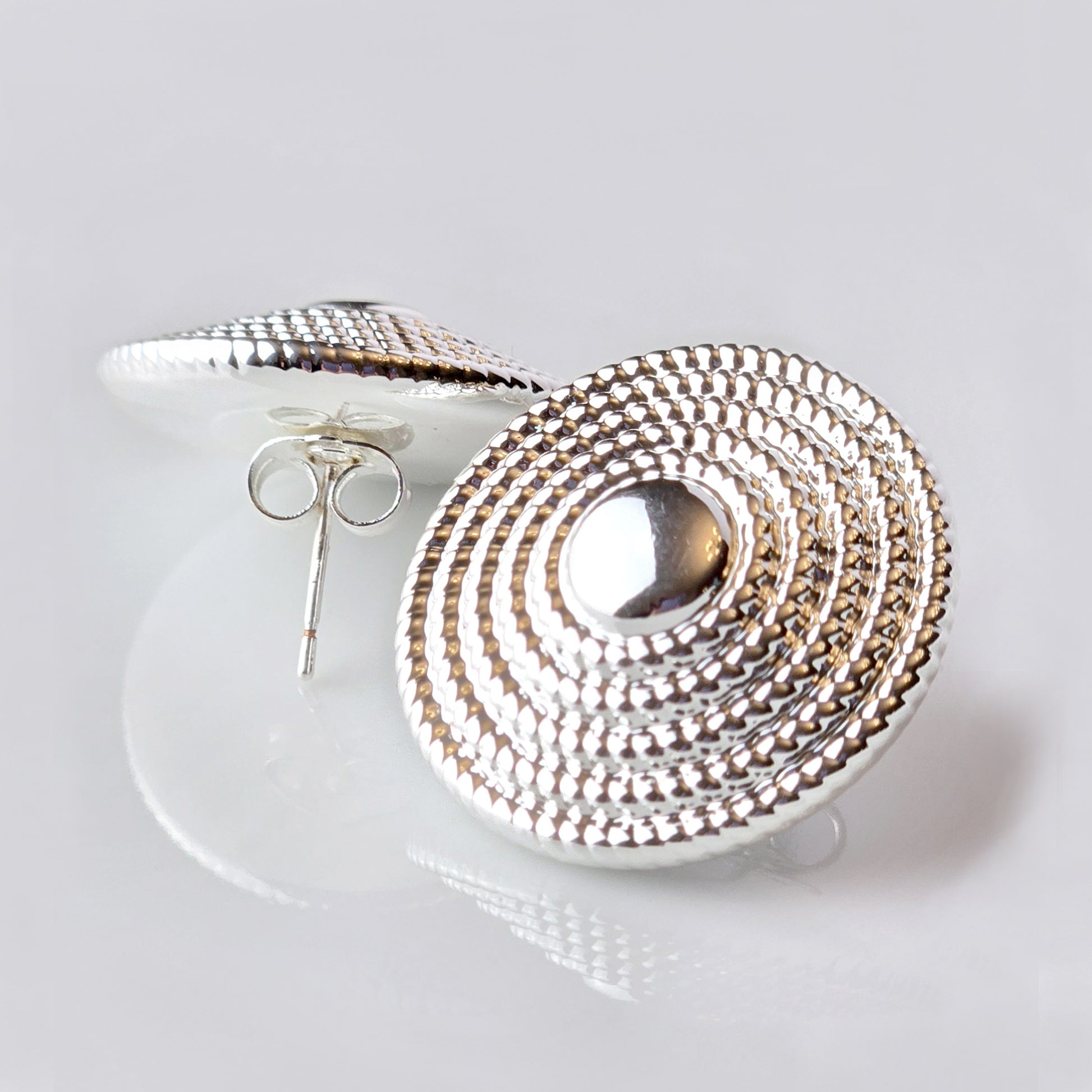 Crafted from the highest quality stainless steel, these Large Silver Hammered Stud Earrings are both hypoallergenic and tarnish-proof, ensuring long-lasting wear. Lightweight and sustainable, they require minimal maintenance. Perfect for everyday wear, these earrings are both stylish and practical.