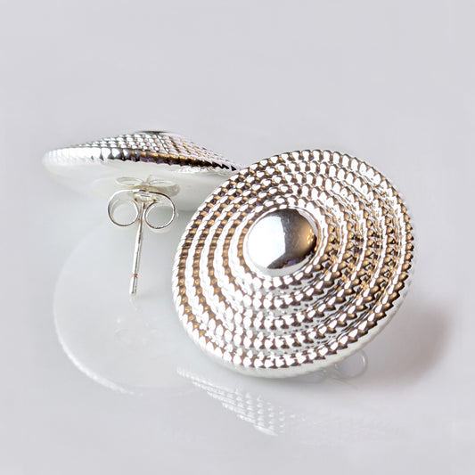 Crafted from the highest quality stainless steel, these Large Silver Hammered Stud Earrings are both hypoallergenic and tarnish-proof, ensuring long-lasting wear. Lightweight and sustainable, they require minimal maintenance. Perfect for everyday wear, these earrings are both stylish and practical.