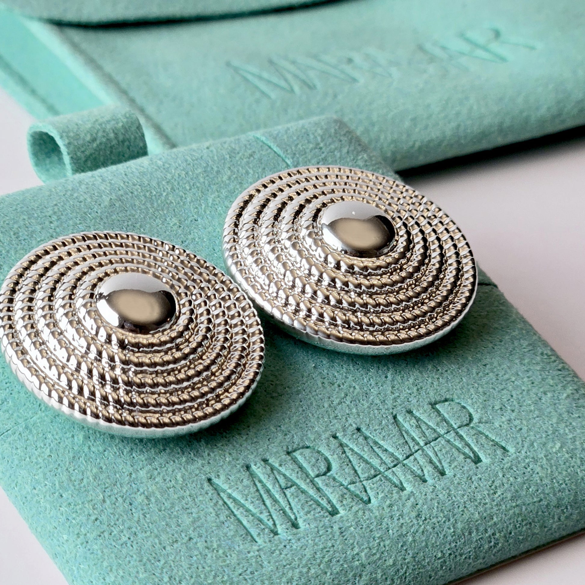 Crafted from the highest quality stainless steel, these Large Silver Hammered Stud Earrings are both hypoallergenic and tarnish-proof, ensuring long-lasting wear. Lightweight and sustainable, they require minimal maintenance. Perfect for everyday wear, these earrings are both stylish and practical.