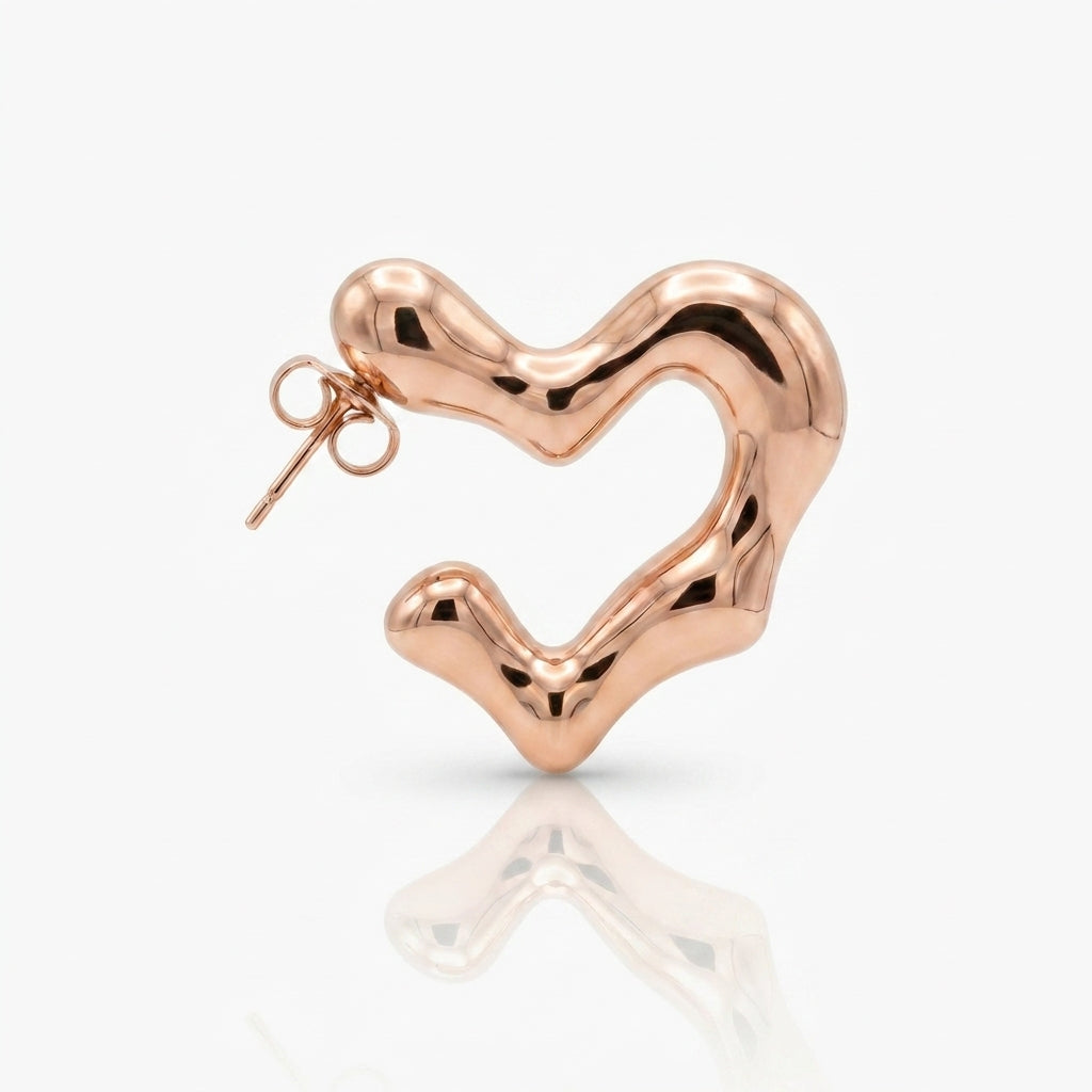 Rose gold heart-shaped earring on a white background Rose gold hoop earrings on a light gray background premium stainless steel hypoallergenic, waterproof, tarnish-proof, and lightweight