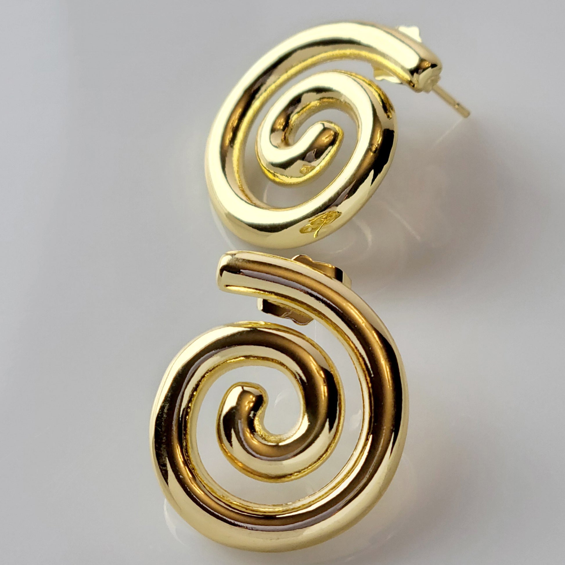 These Medium Gold Spiral Stud Earrings are crafted with highest quality hypoallergenic stainless steel, ensuring they are both tarnish-proof and sustainable. With low maintenance and a lightweight design, these earrings are perfect for everyday wear.