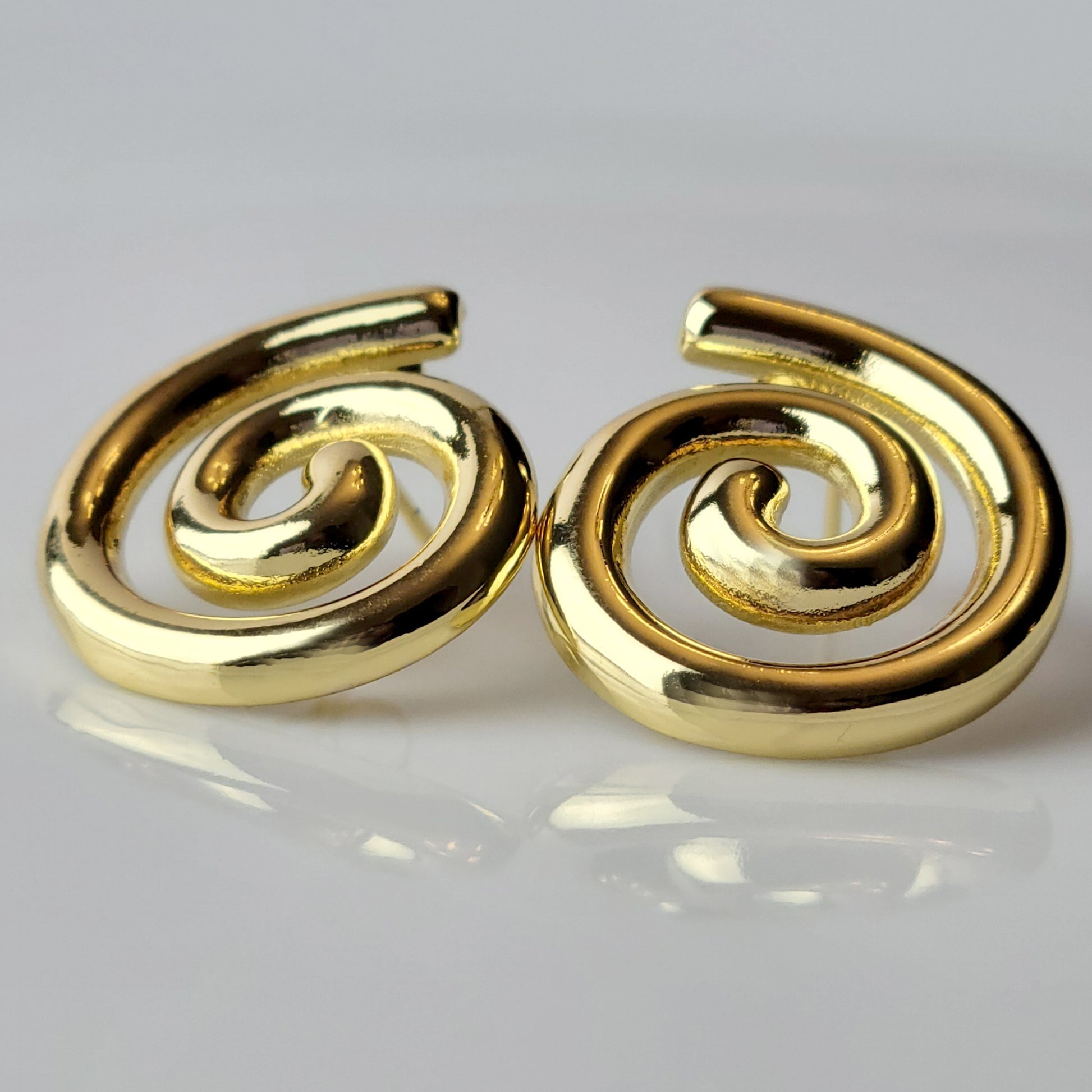 These Medium Gold Spiral Stud Earrings are crafted with highest quality hypoallergenic stainless steel, ensuring they are both tarnish-proof and sustainable. With low maintenance and a lightweight design, these earrings are perfect for everyday wear.