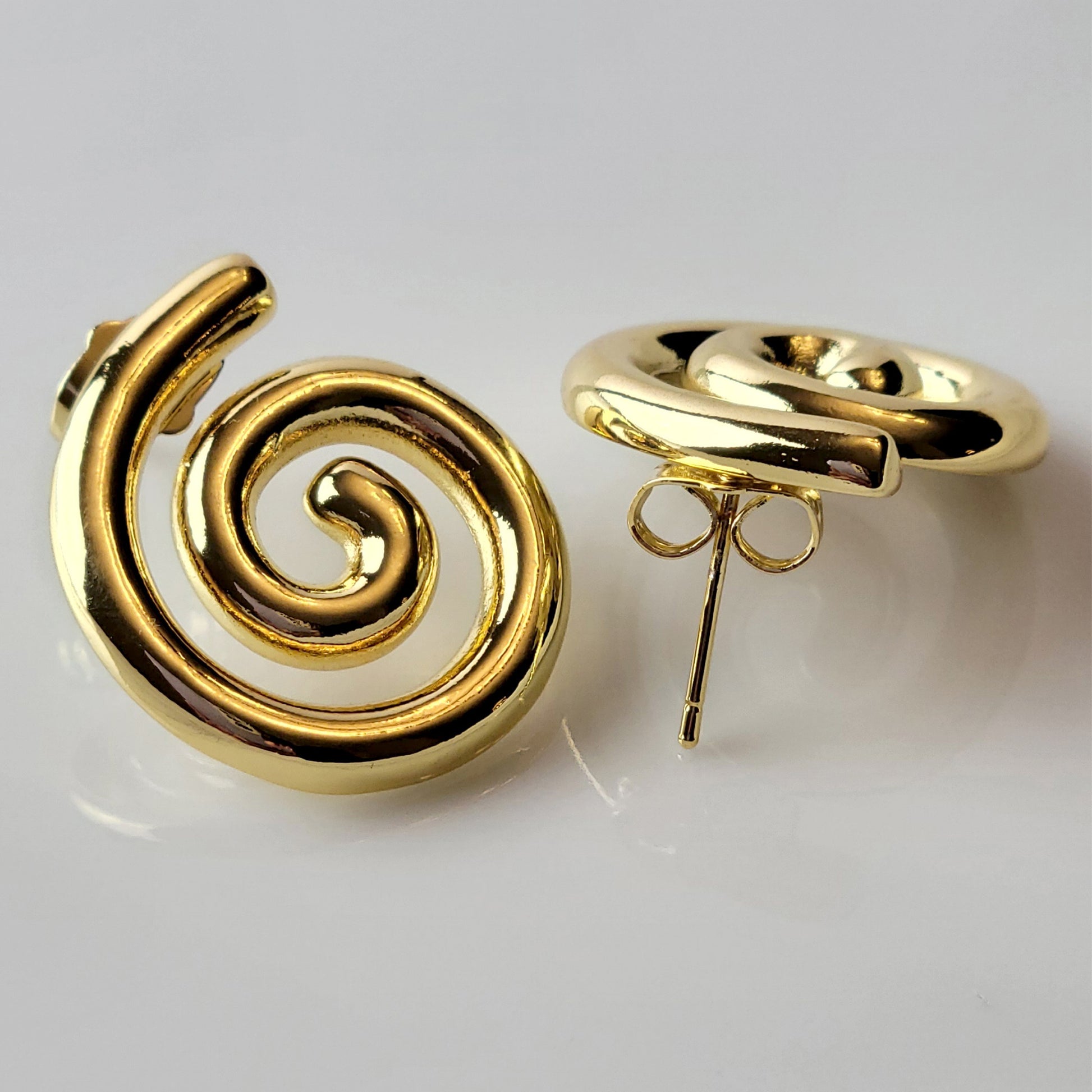 These Medium Gold Spiral Stud Earrings are crafted with highest quality hypoallergenic stainless steel, ensuring they are both tarnish-proof and sustainable. With low maintenance and a lightweight design, these earrings are perfect for everyday wear.