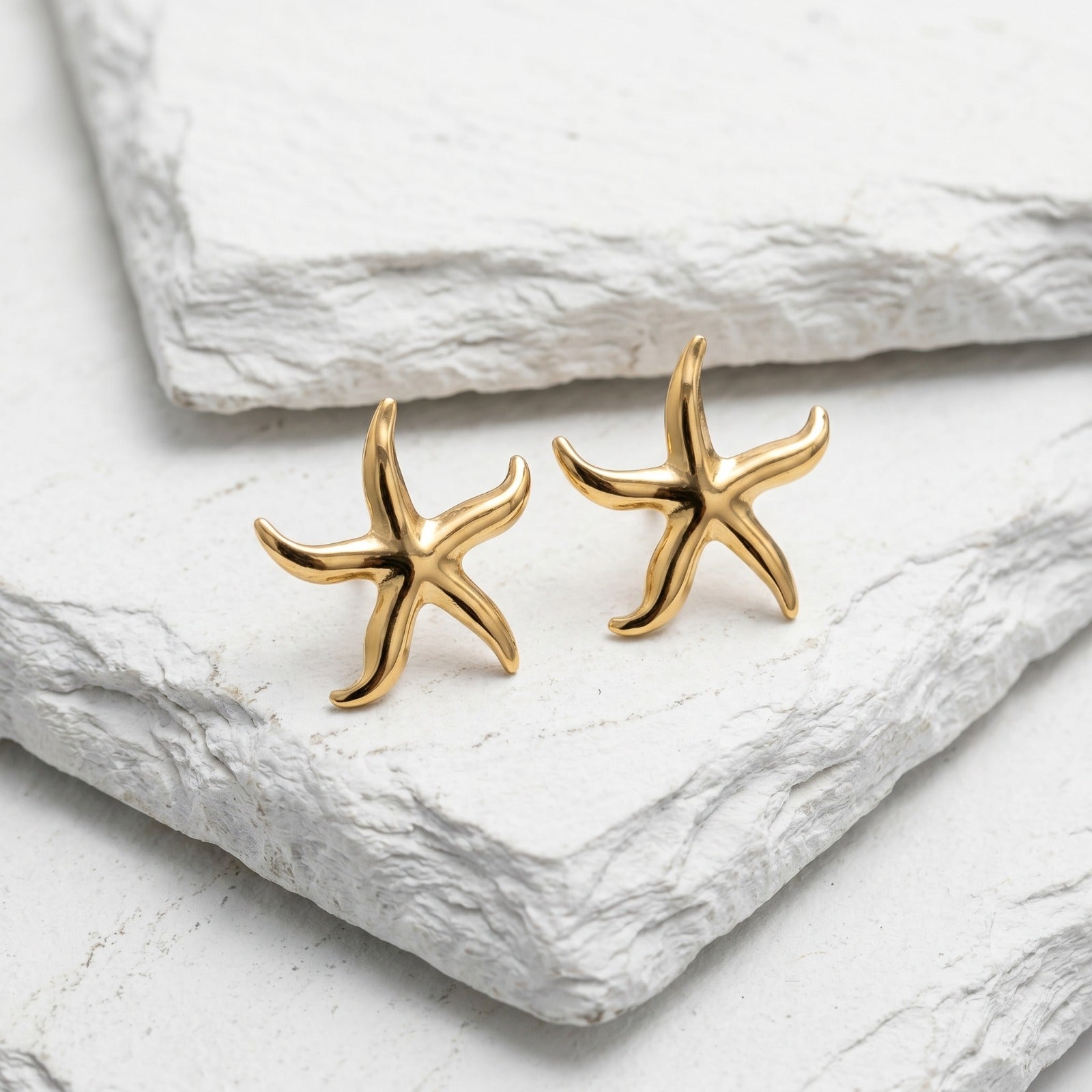 Inspired by treasures found along the shoreline, these elegant starfish earrings were handpicked for the MarAmar Coastal Elegance Collection. Featuring a polished gold finish and stainless steel construction, they offer waterproof durability and lasting beauty. The perfect accessory for effortless coastal sophistication.