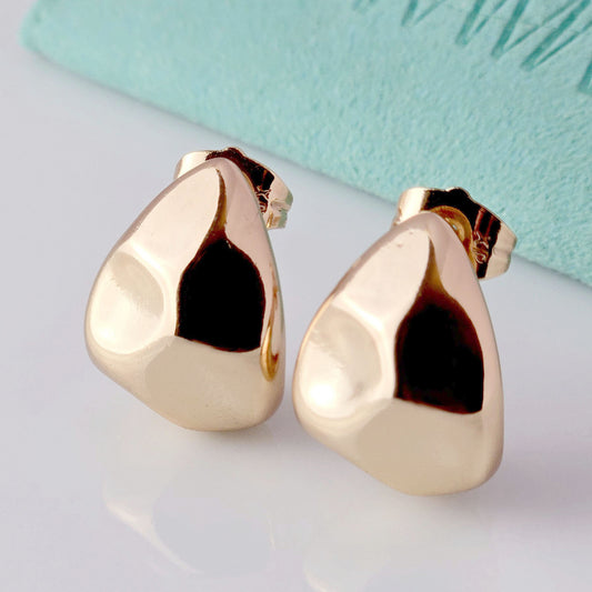 Crafted from the highest quality hypoallergenic, tarnish-proof, and sustainable stainless steel, these medium rose gold chunky drop earrings offer low maintenance and lightweight wear. Perfect for adding a touch of elegance and style to any outfit.