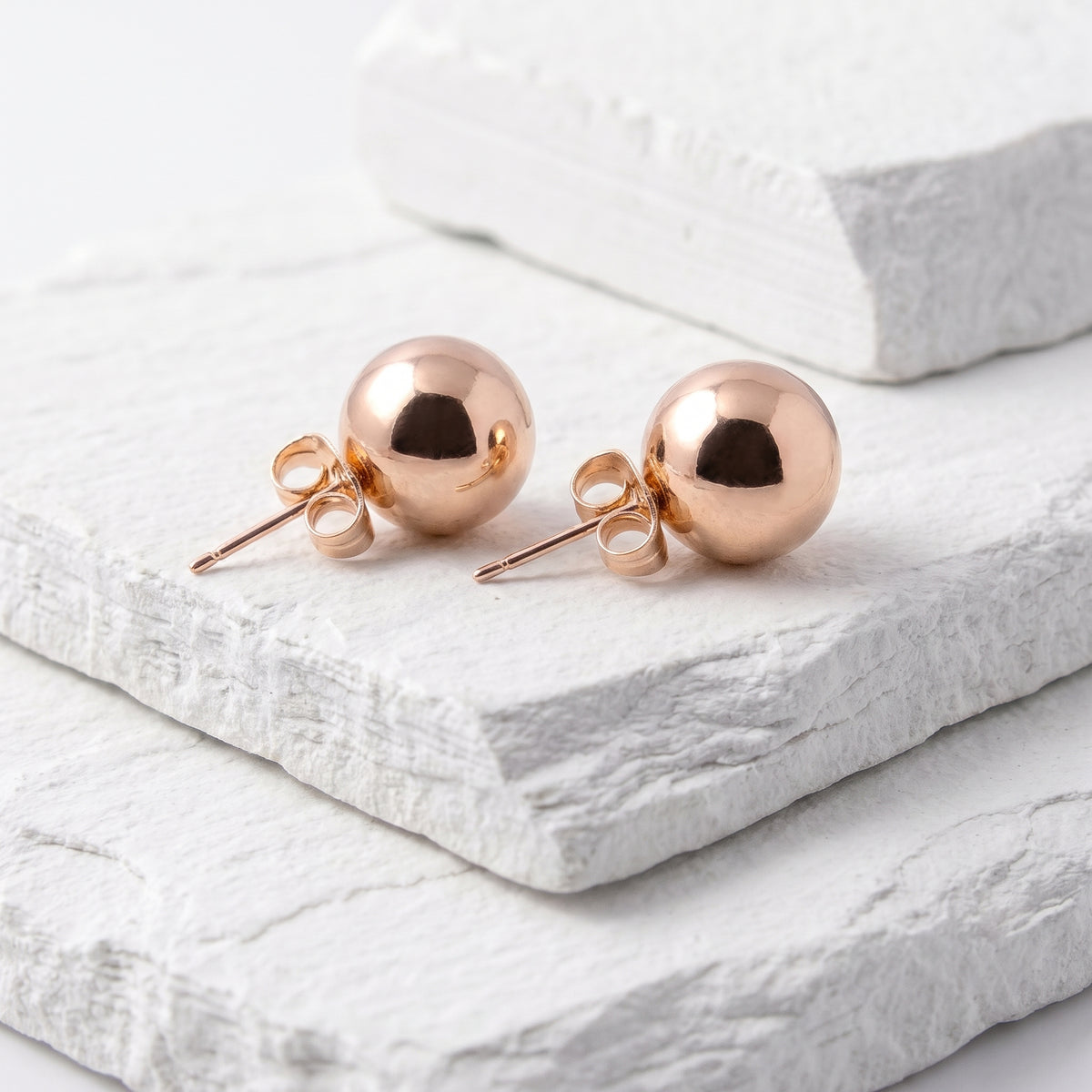 Made with the highest quality hypoallergenic, tarnish-proof stainless steel, our Medium Rose Gold Classic Ball Stud Earrings are both sustainable and low maintenance. You can wear these lightweight earrings every day without worrying about any allergic reactions or tarnishing. Upgrade your jewelry collection with these timeless and durable studs.