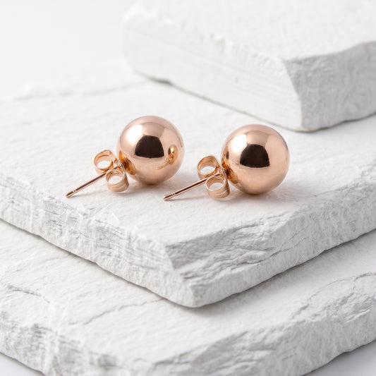 Made with the highest quality hypoallergenic, tarnish-proof stainless steel, our Medium Rose Gold Classic Ball Stud Earrings are both sustainable and low maintenance. You can wear these lightweight earrings every day without worrying about any allergic reactions or tarnishing. Upgrade your jewelry collection with these timeless and durable studs.