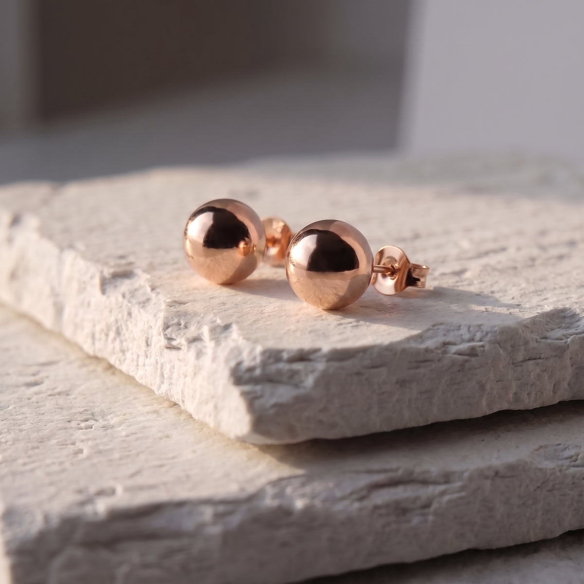 Made with the highest quality hypoallergenic, tarnish-proof stainless steel, our Medium Rose Gold Classic Ball Stud Earrings are both sustainable and low maintenance. You can wear these lightweight earrings every day without worrying about any allergic reactions or tarnishing. Upgrade your jewelry collection with these timeless and durable studs.