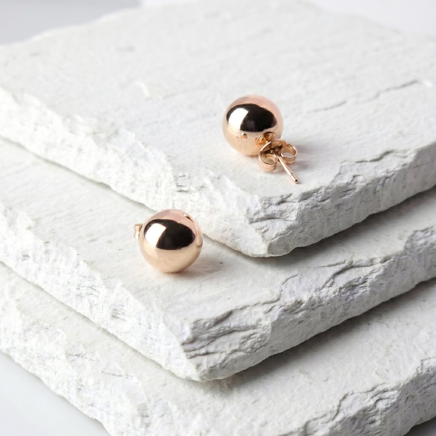 Made with the highest quality hypoallergenic, tarnish-proof stainless steel, our Medium Rose Gold Classic Ball Stud Earrings are both sustainable and low maintenance. You can wear these lightweight earrings every day without worrying about any allergic reactions or tarnishing. Upgrade your jewelry collection with these timeless and durable studs.