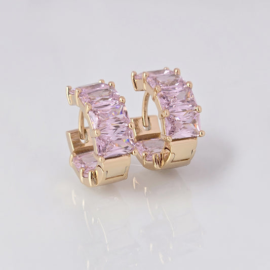 Add a touch of elegance to any outfit with our Medium Rose Gold Pink Sparkle Huggie Earrings. Made of the highest quality hypoallergenic stainless steel, these earrings are tarnish-proof and sustainable, making them a low maintenance and lightweight option for everyday wear. Elevate your style with confidence.