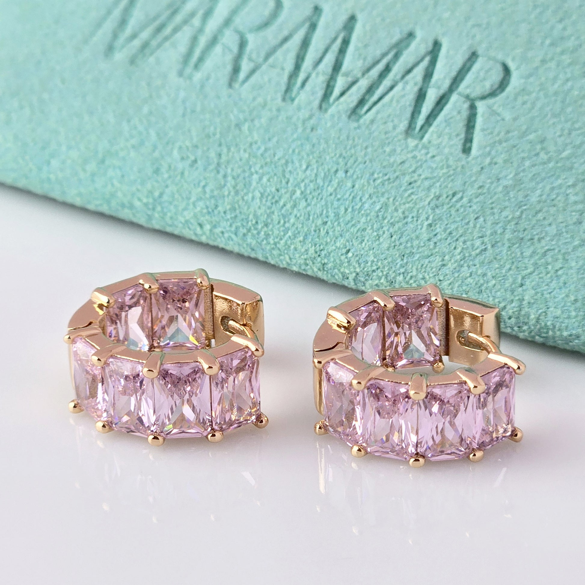 
Add a touch of elegance to any outfit with our Medium Rose Gold Pink Sparkle Huggie Earrings. Made of the highest quality hypoallergenic stainless steel, these earrings are tarnish-proof and sustainable, making them a low maintenance and lightweight option for everyday wear. Elevate your style with confidence.