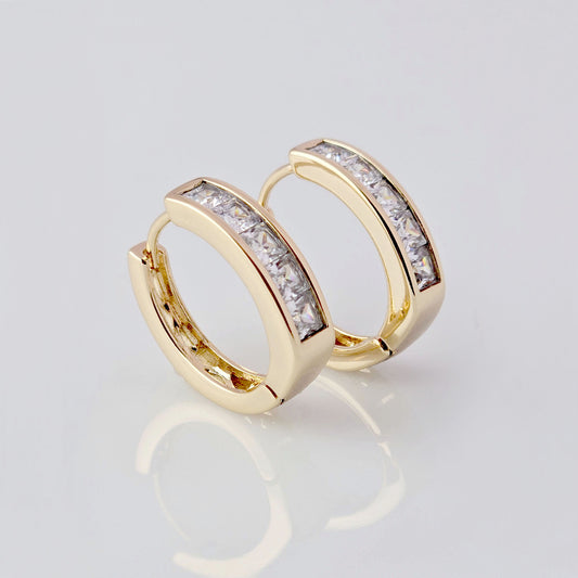 These Medium Rose Gold Sparkle Huggie Earrings are crafted with the highest quality hypoallergenic stainless steel, making them tarnish-proof and sustainable. Their low maintenance and lightweight design provides both comfort and durability. Perfect for adding a touch of elegance to any outfit.