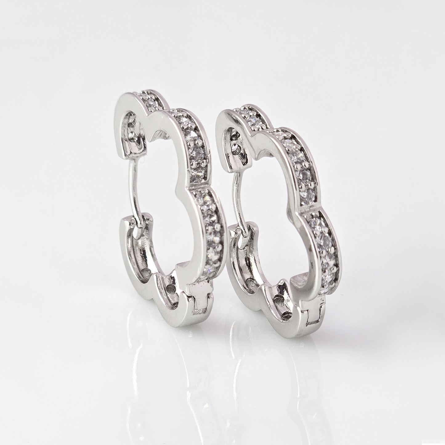 Crafted with precision and expertise, our Medium Silver Sparkle Daisy Hoop Earrings are the epitome of quality. Made from hypoallergenic stainless steel, these earrings are tarnish-proof and sustainable, providing a low maintenance, lightweight option for everyday wear. Elevate any outfit with a touch of elegance and durability.