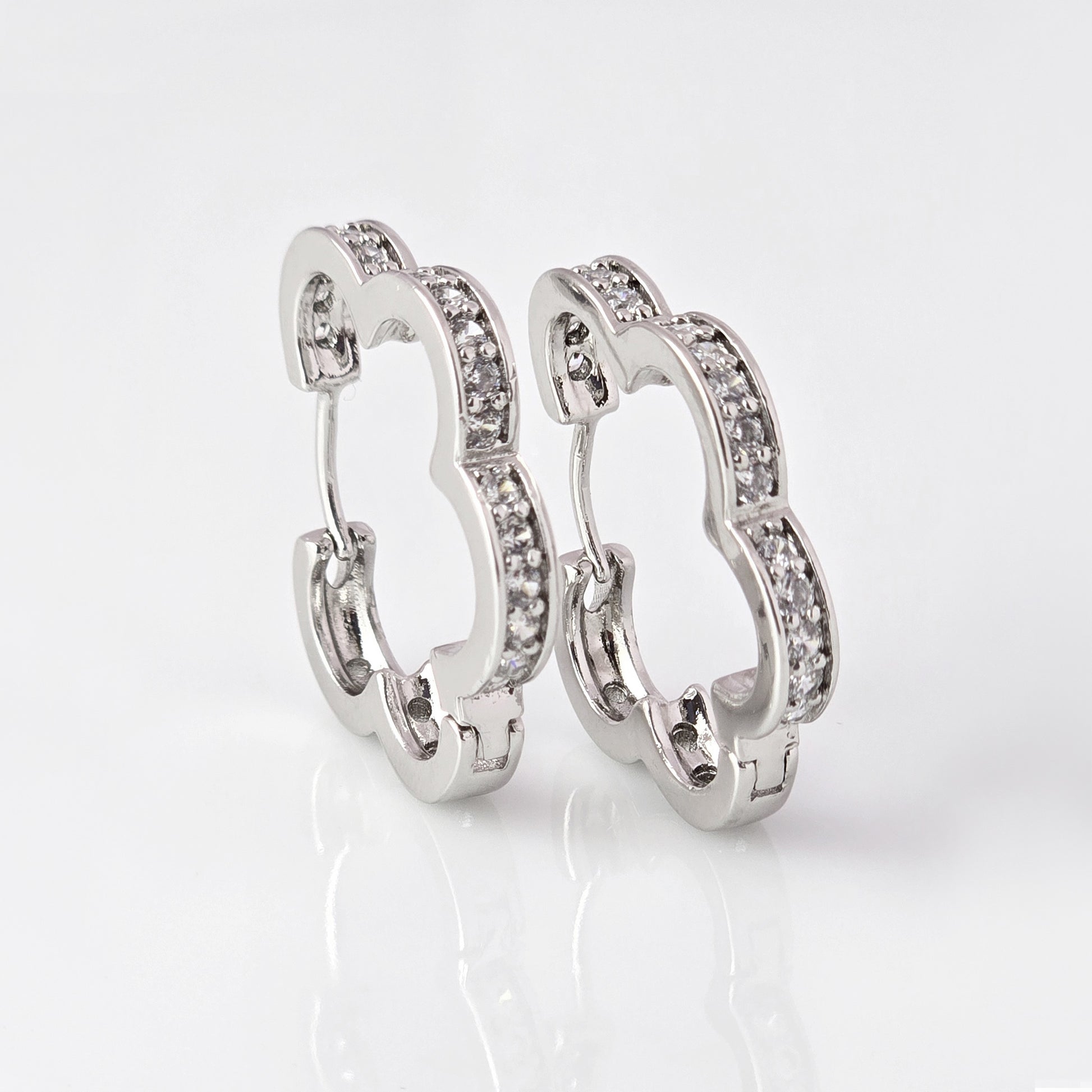 Crafted with precision and expertise, our Medium Silver Sparkle Daisy Hoop Earrings are the epitome of quality. Made from hypoallergenic stainless steel, these earrings are tarnish-proof and sustainable, providing a low maintenance, lightweight option for everyday wear. Elevate any outfit with a touch of elegance and durability.