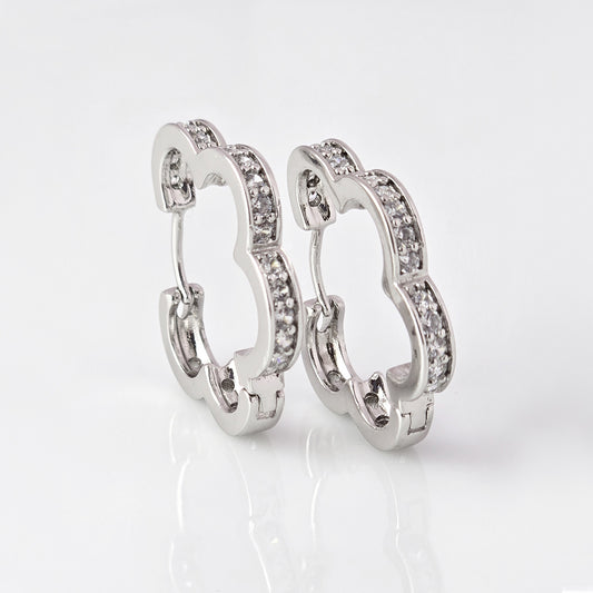 Crafted with precision and expertise, our Medium Silver Sparkle Daisy Hoop Earrings are the epitome of quality. Made from hypoallergenic stainless steel, these earrings are tarnish-proof and sustainable, providing a low maintenance, lightweight option for everyday wear. Elevate any outfit with a touch of elegance and durability.