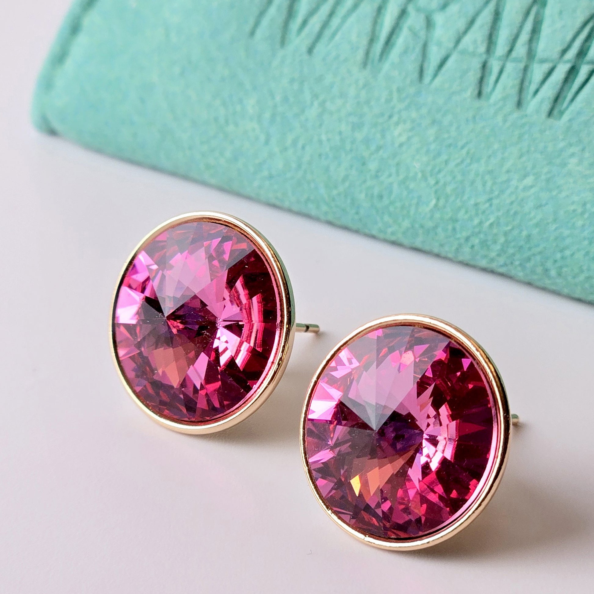 Crafted with high-quality stainless steel, these rose gold pink sparkle stud earrings are hypoallergenic, water-resistant, and sweat-resistant. With a tarnish-proof finish, they are low maintenance and sustainable. Perfect for any occasion.