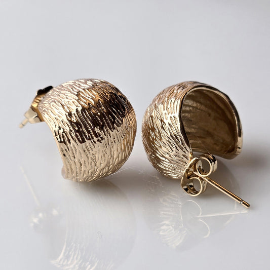 Expertly crafted in the finest hypoallergenic stainless steel, these Rose Gold Rustic Bubble Hoop Earrings are not only stylish but also durable and sustainable. With water and sweat-resistant properties, they require minimal maintenance and offer long-lasting wear. Lightweight and tarnish-proof for a comfortable and chic look.