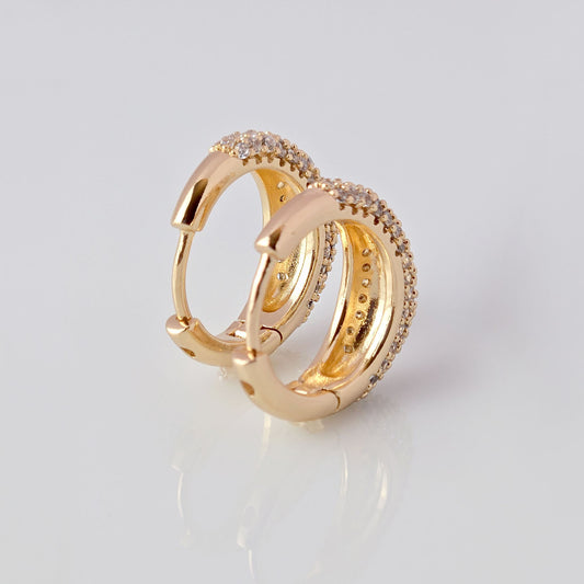 With sparkles and shine, these rose gold huggie earrings add a touch of elegance to any outfit. Made of hypoallergenic stainless steel, they are gentle on sensitive ears. Tarnish-proof and sustainable, these low maintenance earrings are a timeless addition to any jewelry collection.