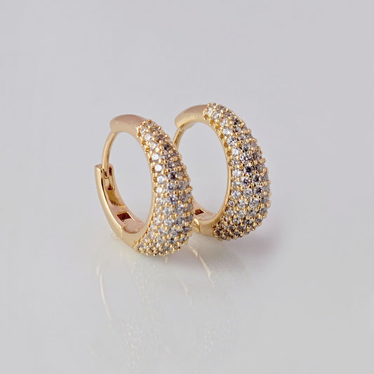 With sparkles and shine, these rose gold huggie earrings add a touch of elegance to any outfit. Made of hypoallergenic stainless steel, they are gentle on sensitive ears. Tarnish-proof and sustainable, these low maintenance earrings are a timeless addition to any jewelry collection.