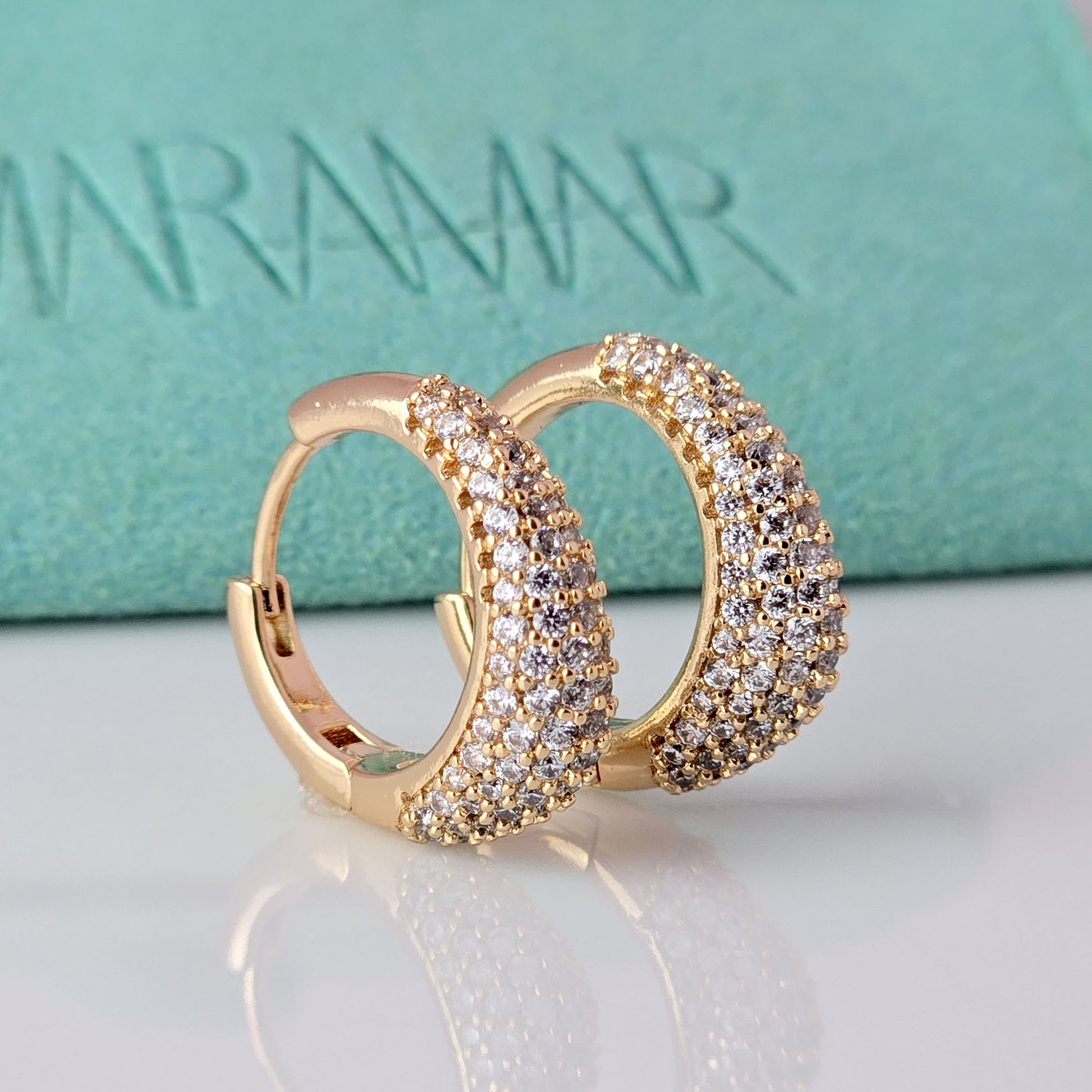 With sparkles and shine, these rose gold huggie earrings add a touch of elegance to any outfit. Made of hypoallergenic stainless steel, they are gentle on sensitive ears. Tarnish-proof and sustainable, these low maintenance earrings are a timeless addition to any jewelry collection.