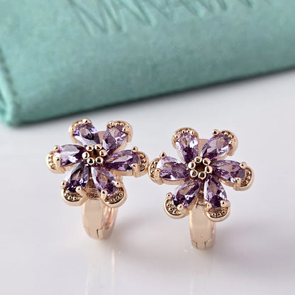 Crafted with the highest quality hypoallergenic stainless steel, these Small Rose Gold Purple Flower Huggie Earrings are both sustainable and lightweight. With a tarnish-proof design and low maintenance requirements, these earrings are a durable and stylish addition to any accessory collection.