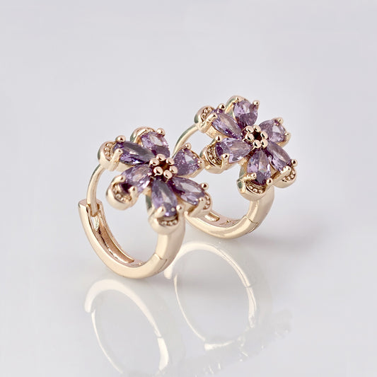 Crafted with the highest quality hypoallergenic stainless steel, these Small Rose Gold Purple Flower Huggie Earrings are both sustainable and lightweight. With a tarnish-proof design and low maintenance requirements, these earrings are a durable and stylish addition to any accessory collection.