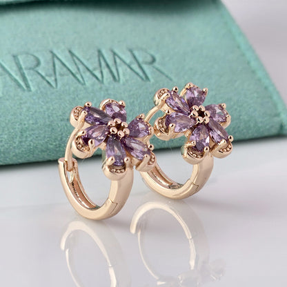 Crafted with the highest quality hypoallergenic stainless steel, these Small Rose Gold Purple Flower Huggie Earrings are both sustainable and lightweight. With a tarnish-proof design and low maintenance requirements, these earrings are a durable and stylish addition to any accessory collection.