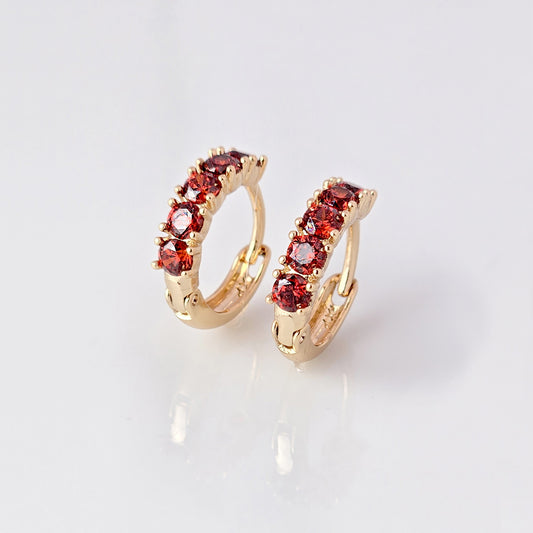Elevate your style with our Small Rose Gold Red Garnet Huggie Earrings. Made from high-quality hypoallergenic stainless steel, these earrings are sustainable, tarnish-proof, and low maintenance while still remaining lightweight. The small size and elegant cut of the red garnet make for a perfect everyday accessory that adds a touch of sophistication to any outfit.