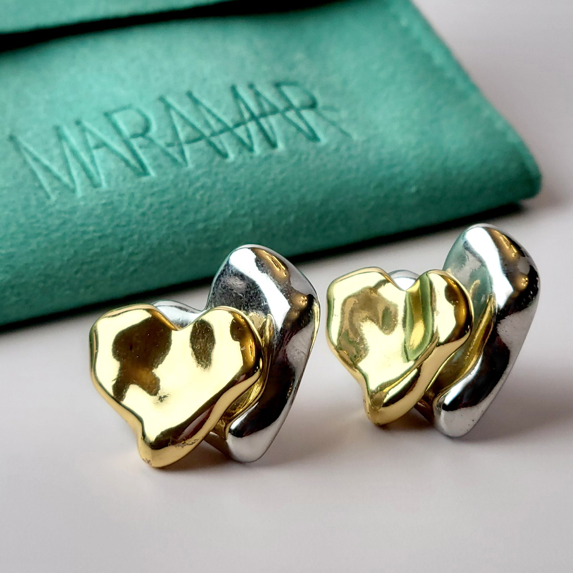 These Two-Tone Double Heart Stud Earrings are expertly crafted with hypoallergenic and sustainable stainless steel for a lightweight and low maintenance wear. With a tarnish-proof design, these earrings will retain their high-quality appearance for years to come. A perfect addition to any jewelry collection.