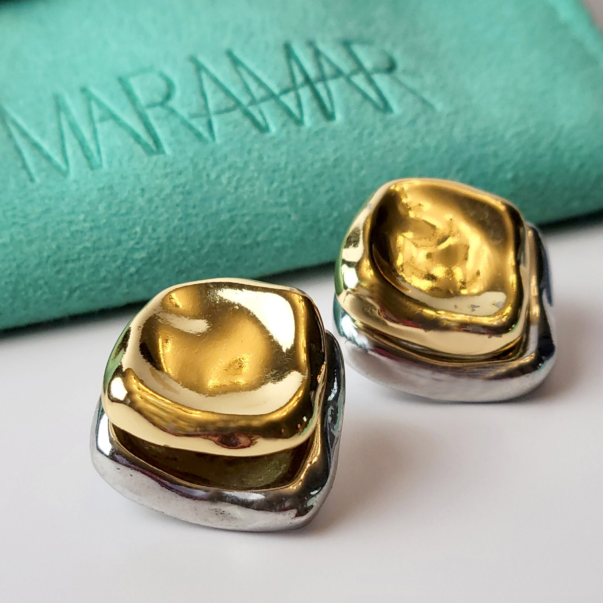 Crafted from premium stainless steel, these Two-Tone Double Square Stud Earrings offer the perfect blend of quality and style. Hypoallergenic and tarnish-proof, they require low maintenance and are lightweight for all-day comfort. Elevate any look with these sustainable earrings.