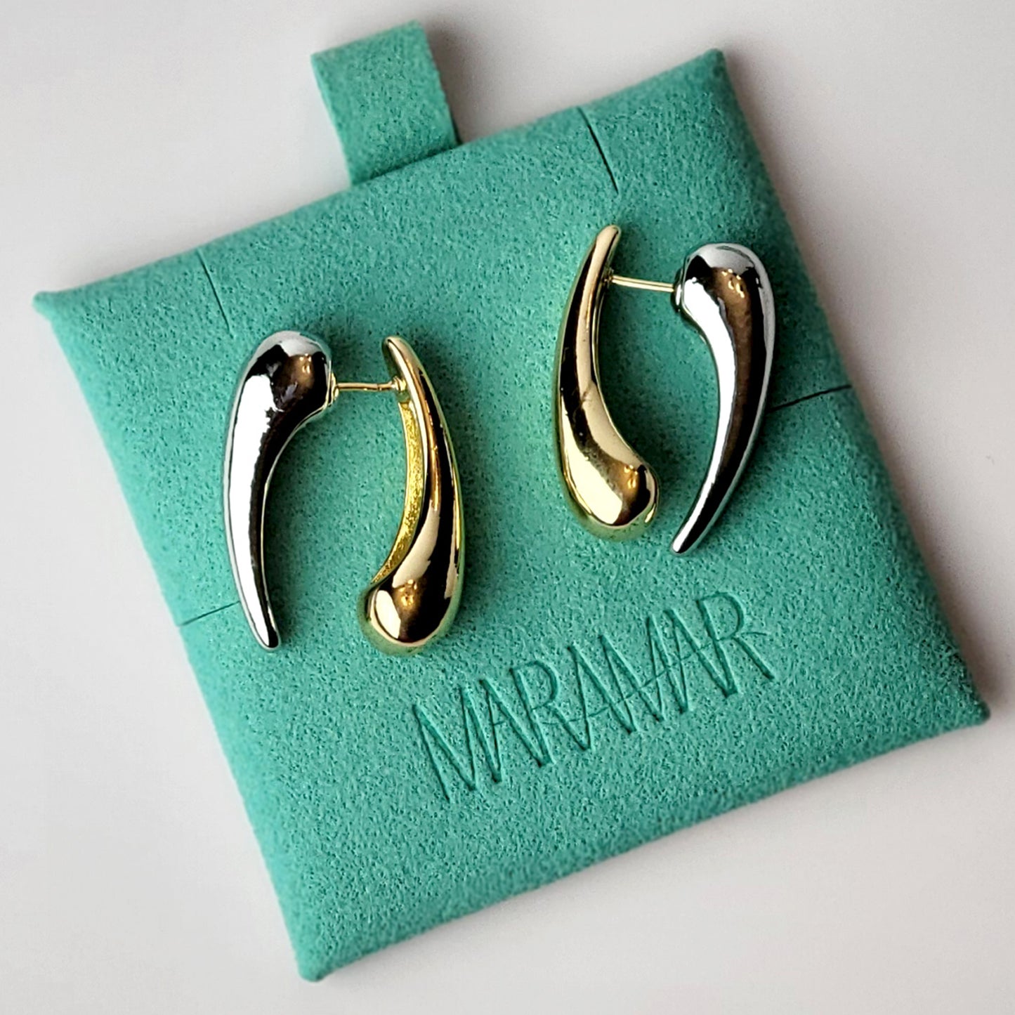 Expertly crafted from hypoallergenic, tarnish-proof stainless steel, these Two-Tone Tear Drop Dangle Earrings are both sustainable and low maintenance. The lightweight design makes them comfortable for all-day wear. Elevate any outfit with these high-quality, expertly-crafted earrings.