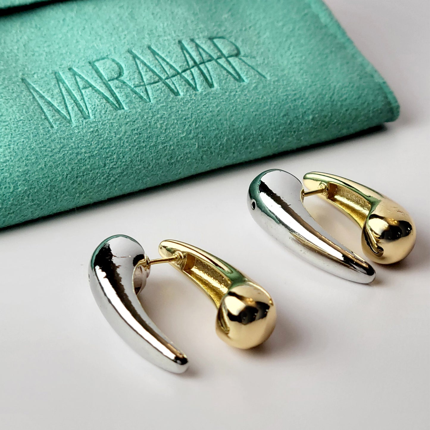 Expertly crafted from hypoallergenic, tarnish-proof stainless steel, these Two-Tone Tear Drop Dangle Earrings are both sustainable and low maintenance. The lightweight design makes them comfortable for all-day wear. Elevate any outfit with these high-quality, expertly-crafted earrings.