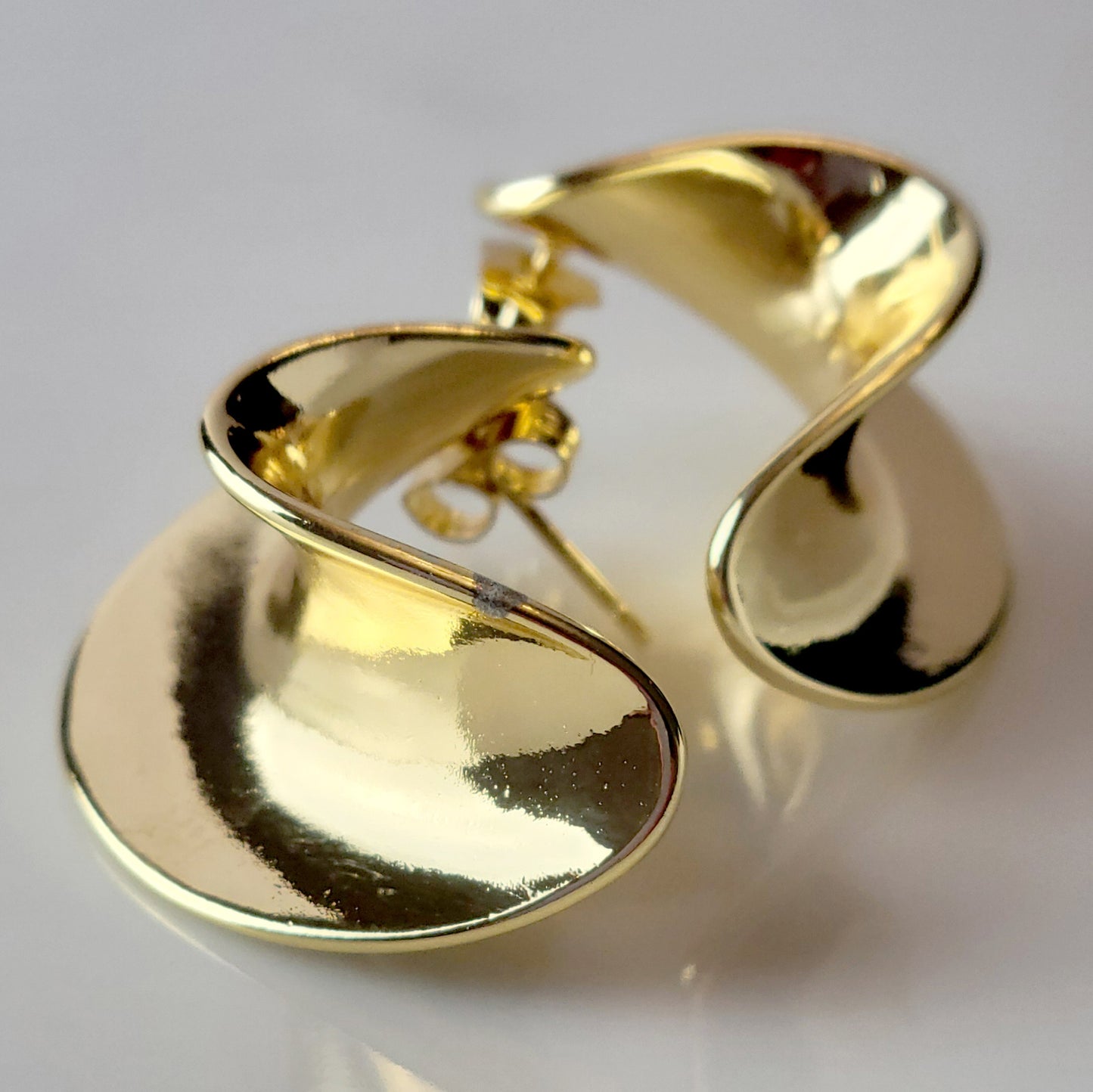 Crafted from the finest hypoallergenic stainless steel, our Weavy Gold Stud Earrings are perfect for those with sensitive ears. These earrings are also tarnish-proof, sustainable, and require minimal upkeep. Enjoy a lightweight and stylish option for any occasion.