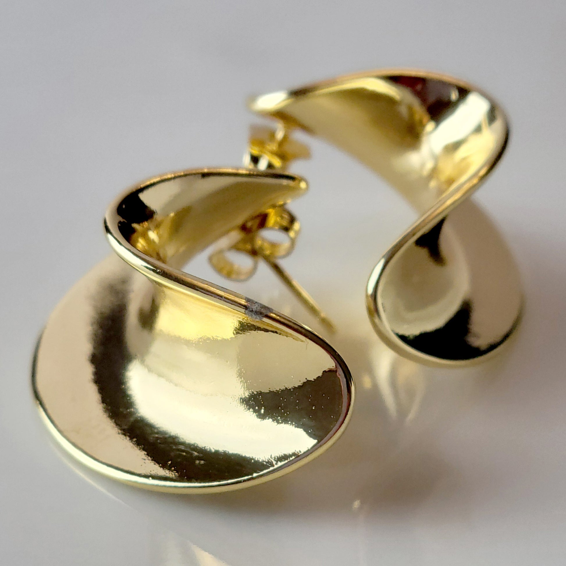 Crafted from the finest hypoallergenic stainless steel, our Weavy Gold Stud Earrings are perfect for those with sensitive ears. These earrings are also tarnish-proof, sustainable, and require minimal upkeep. Enjoy a lightweight and stylish option for any occasion.