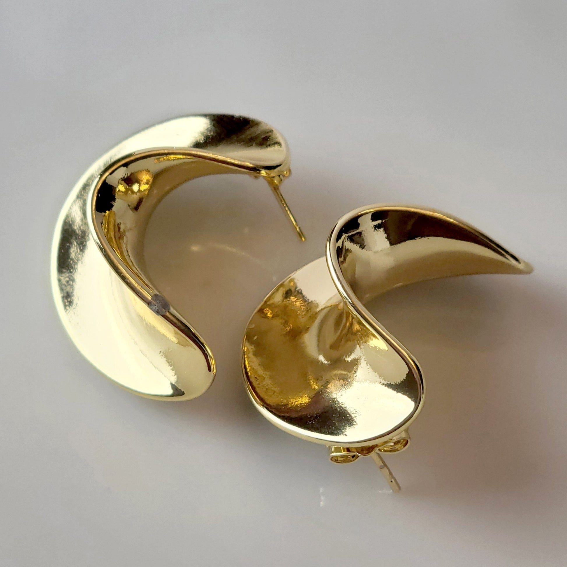 Crafted from the finest hypoallergenic stainless steel, our Weavy Gold Stud Earrings are perfect for those with sensitive ears. These earrings are also tarnish-proof, sustainable, and require minimal upkeep. Enjoy a lightweight and stylish option for any occasion.