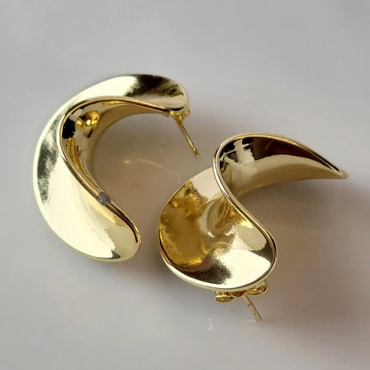 Crafted from the finest hypoallergenic stainless steel, our Weavy Gold Stud Earrings are perfect for those with sensitive ears. These earrings are also tarnish-proof, sustainable, and require minimal upkeep. Enjoy a lightweight and stylish option for any occasion.